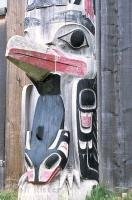 A close up of a totem pole in Old Masset in the Queen Charlotte Islands in British Columbia, Canada.