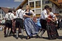 Dancers perform a traditional Bavarian dance at the Maibaumfest in Putzbrunn, Germany.