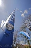 A traditional sign is secured to the Maibaum with the Bavarian flag in Putzbrunn, Germany.