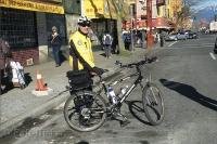 A Vancouver Police Officer poses beside his bike in Chinatown in Vancouver, British Columbia in Canada.