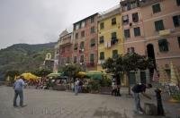 Even on a cloudy day in the village of Vernazza, Liguria in Italy, people still love to spend time at a waterfront cafe and take in the beauty of this ideal vacation spot.