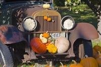 In Keremeos, British Columbia, a vintage car, pumpkins and squash grace an autumn display at a farmers' market stall along Highway 3.