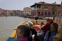 The Vaporetto is a water bus where passengers enjoy the view of the Grand Canal in Venice, Italy in Europe.