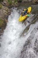 Running a waterfall in a kayak is one of the popular water sports.