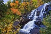 Beautiful Chutes aux Rats waterfall surrounded by fall colors in Parc national du Mont Tremblant in the Canadian province of Quebec.