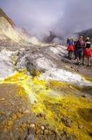 The visitors who come to White Island, New Zealand spend their time hiking and exploring the volcano landscape.