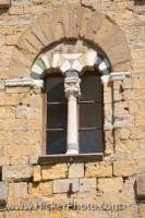 One of the many windows on the facade of the Palazzo Pretorio in the city of Volterra, Tuscany in Italy.