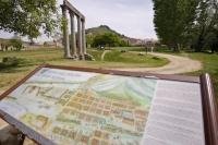 An information sign displaying a map of the Monte St Maxime which rises behind the Roman columns in Riez, Provence in France.