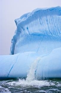 photo of Global Warming Melting Iceberg Pouring Water