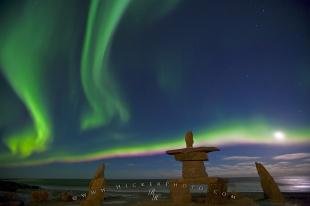 photo of Northern Lights Dancing In The Moon Light Inukshuk Hudson Bay
