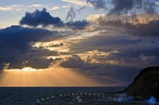 photo of Storm Clouds Sunset Sun Beams Ocean
